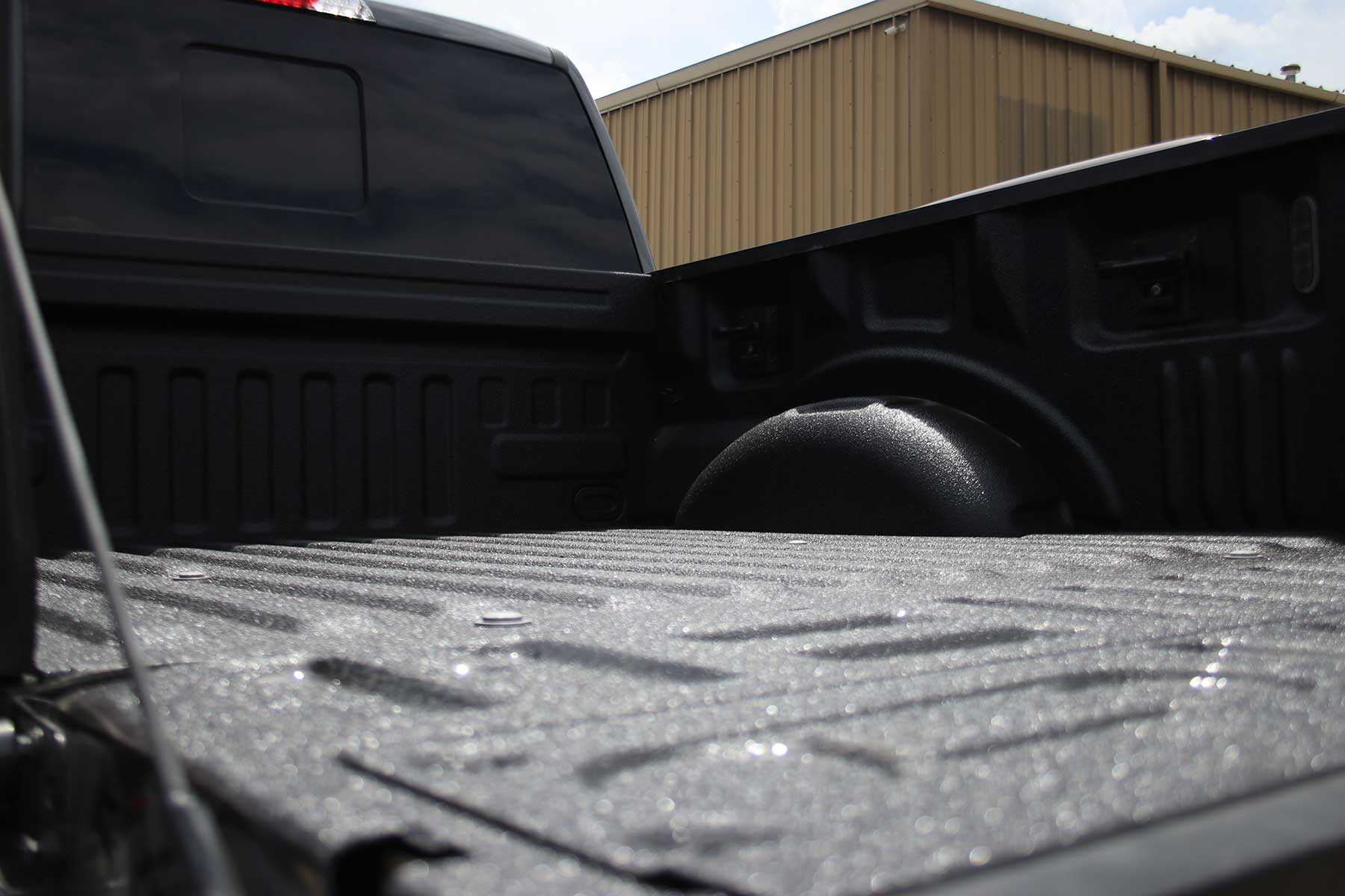 Truck bed with spray liner
